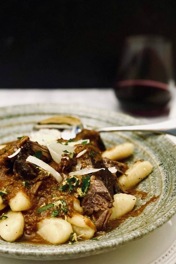 grey bowl with shortribs and gnocchi