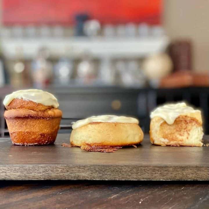 3 different shaped cinnamon rolls on wood board