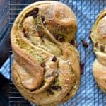 baked bread stuffed with pesto and sindried tomatoes on cooling rack