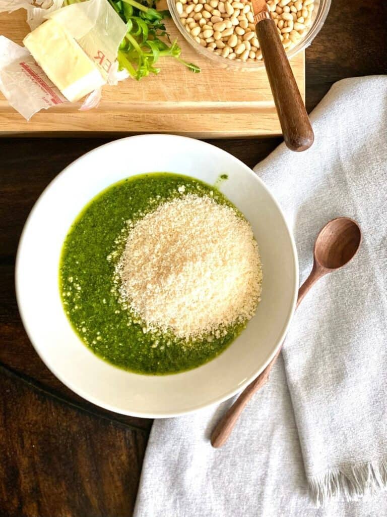 bowl of pesto with grated cheese not mixed in