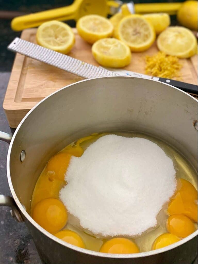 sauce pan filled with lemon tart filling ingredients