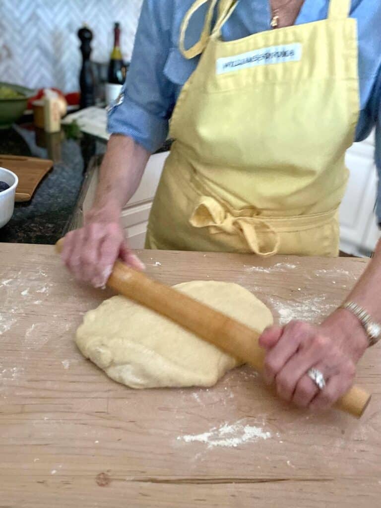 my mother in law rolling dough for plum kuchen