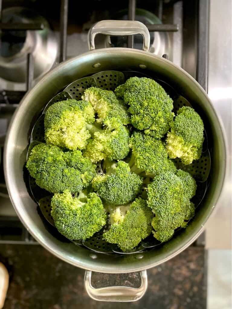 raw broccoli prepped in steamer