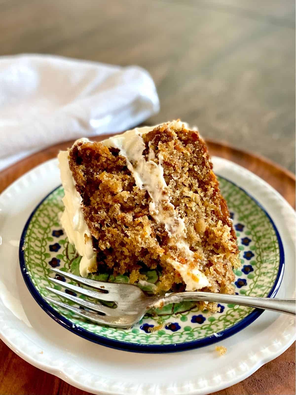 slice of carrot cake on plate with fork