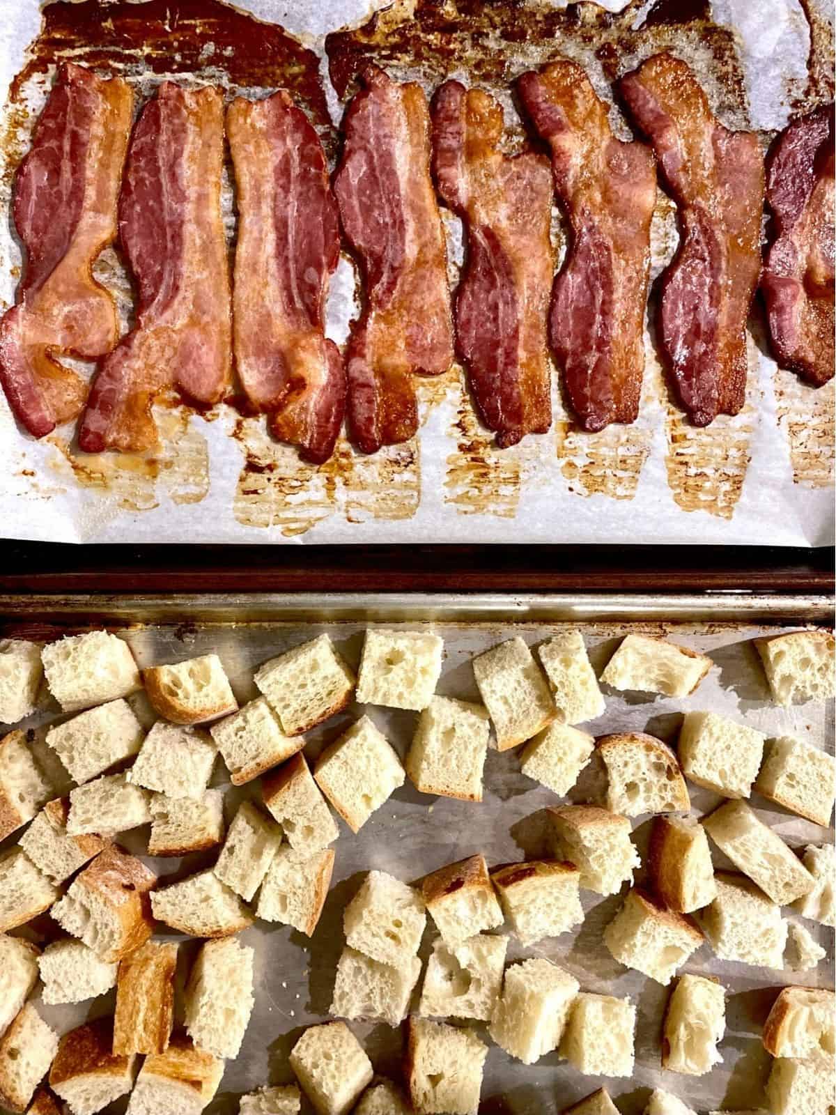 baking sheets with cooked bacon and crisped bread cubes