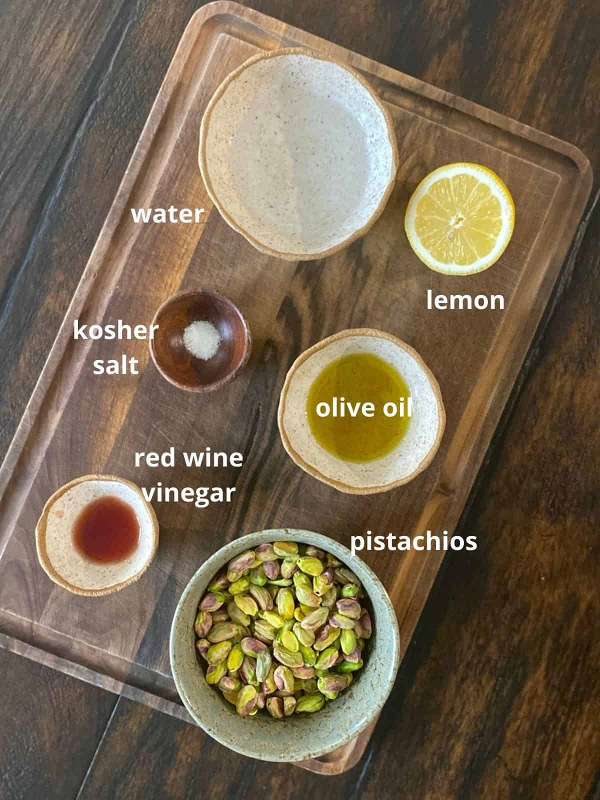 ingredients for pistachio butter on wood board