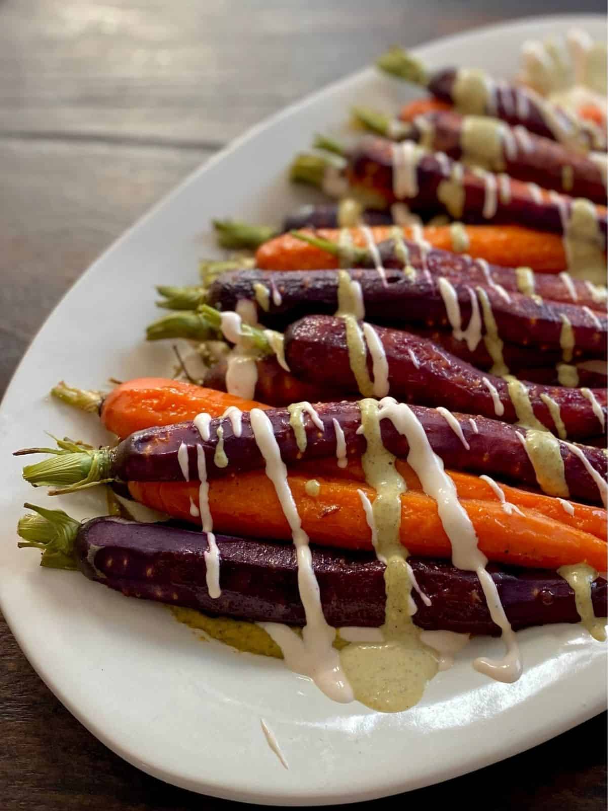 rainbow carrots with pistachio butter and feta cream close up