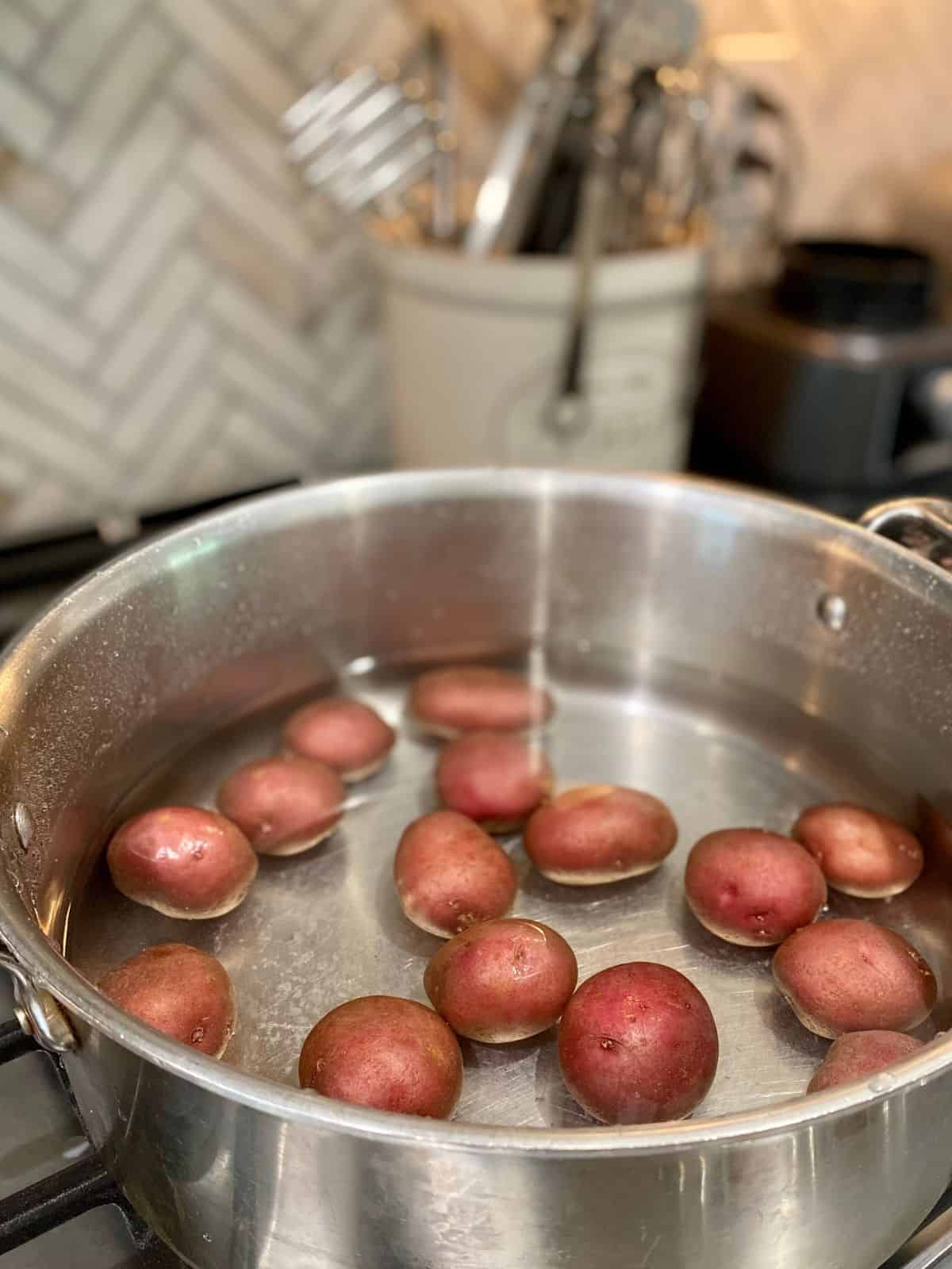 redskin potatoes in pot of water