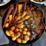 english roast with carrots and potatoes in roaster
