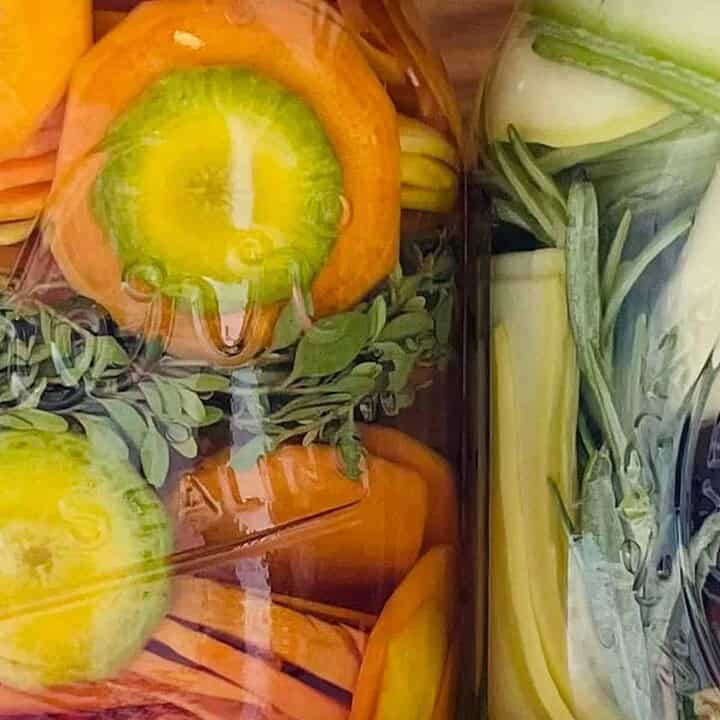 close up of pickles in jars