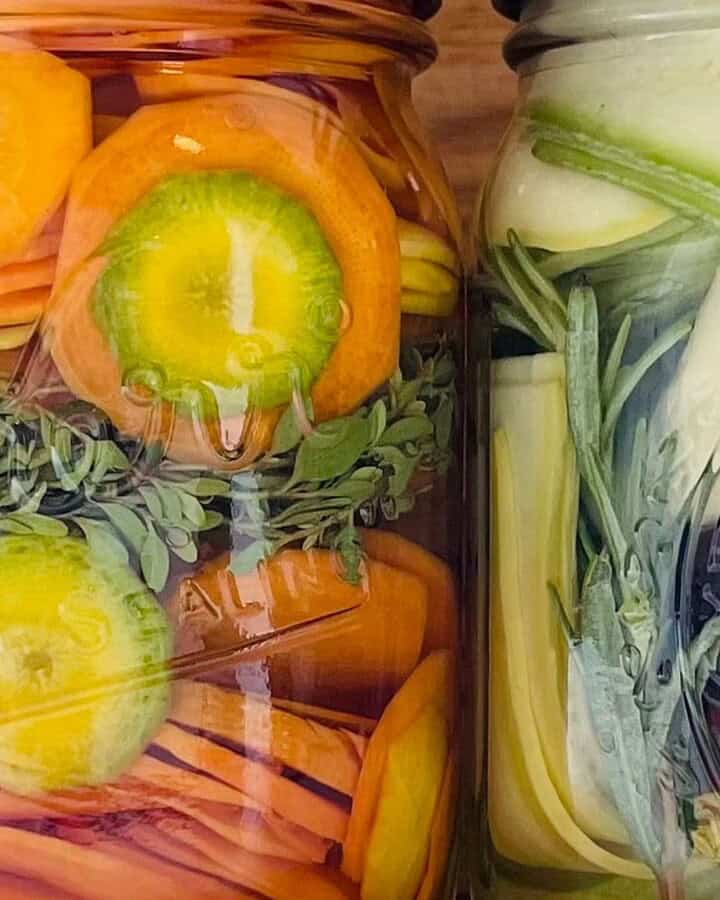 close up of pickles in jars